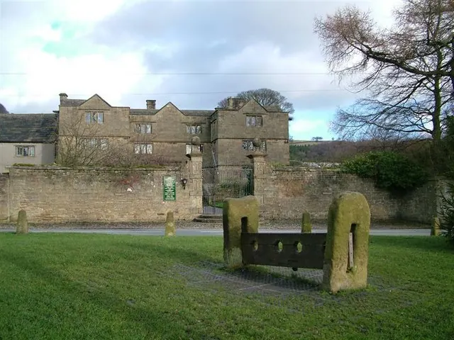 Eyam Hall and the village stocks