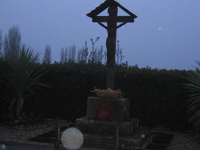 War Memorial in Utkinton Village, near open Cheshire farmland