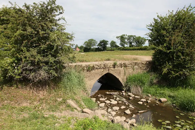 Old bridge crossing stream
