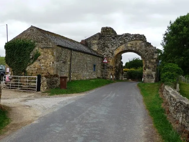 Ruined medieval gatehouse arch
