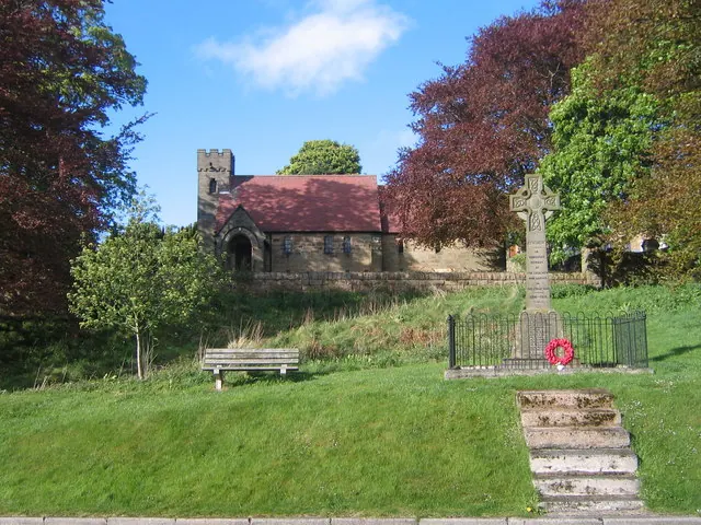 Poppies at the war memorial in Lealholm