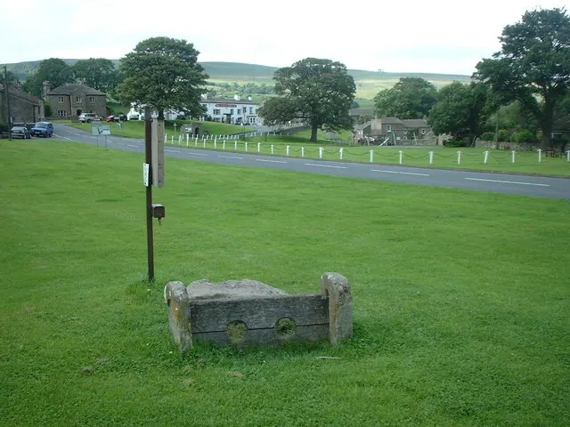 Ancient stocks on village green in Bainbridge