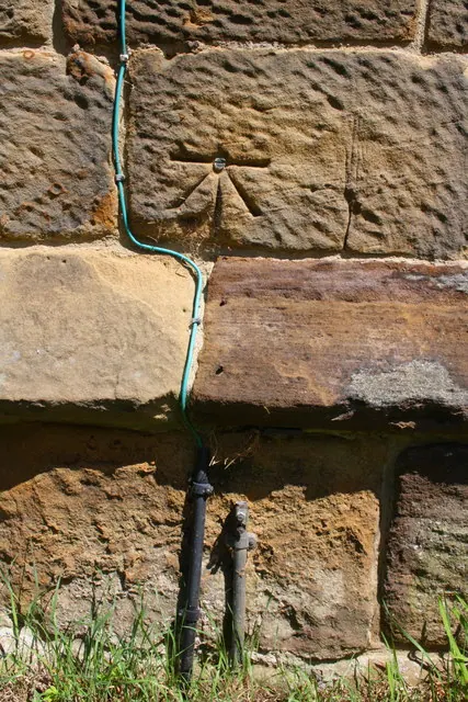 Benchmark on the tower of Danby Wiske Parish Church