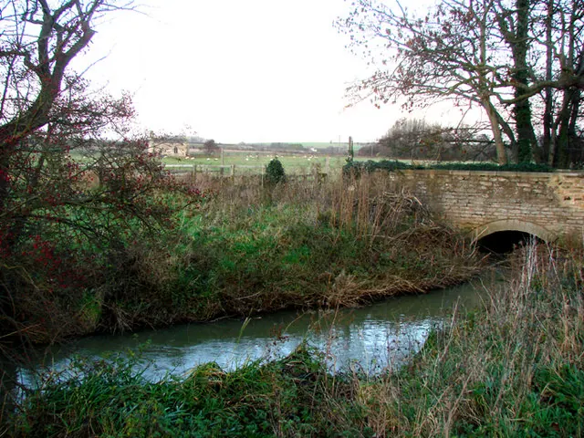 Bridge over Cock Beck, with Lead Parish Church visible in the distance.