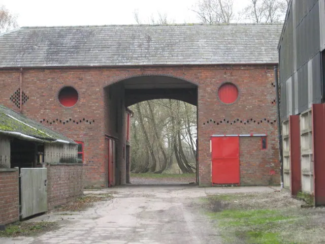 An elegant brick barn at Woodford Hall farm