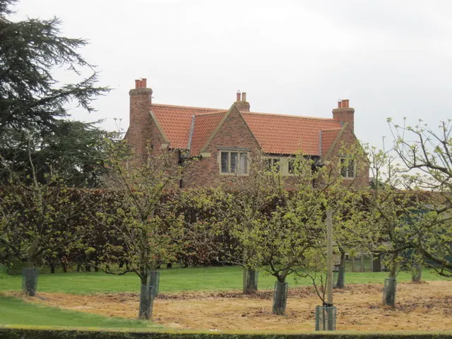 House  at  Moxby  Priory  Farm  through  Orchard