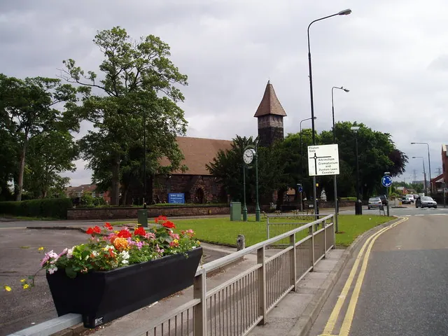 Clock at road junction near St Mary's Church Partington