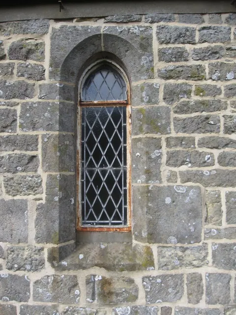 Lancet window and mass clock, St Leonard's, Speeton