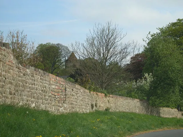 Church of the Ascension Tower behind a well kept wall