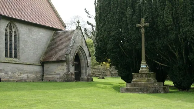 Entrance porch and First World War memorial in St. Mary's Churchyard